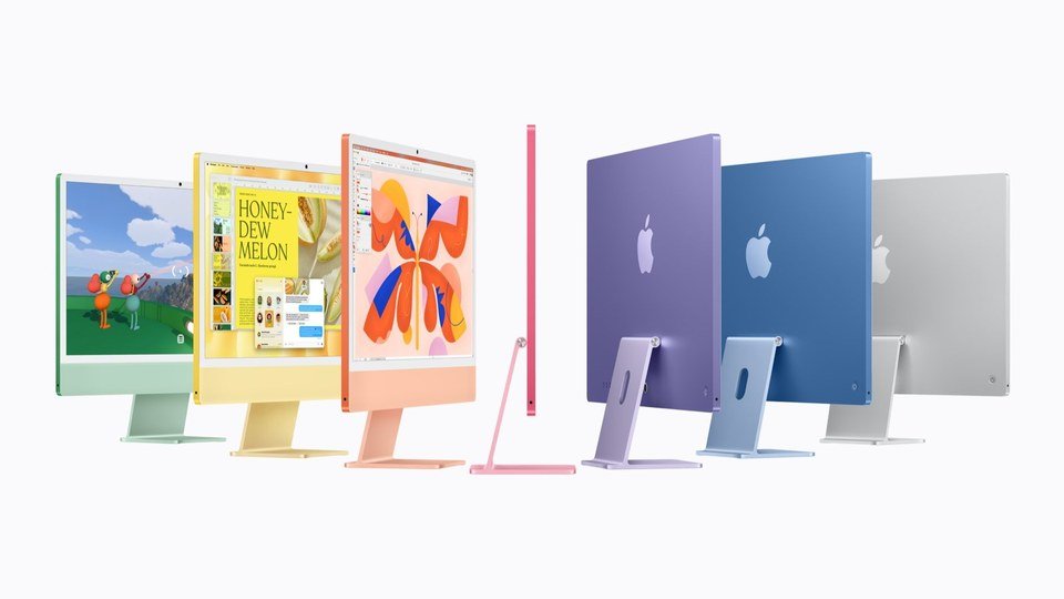 Apple marketing image posted on X by @WigettaGaming: seven M6 iMacs in green, yellow, orange, pink, purple, blue and silver stand side by side on a white background, Oct. 27, 2026