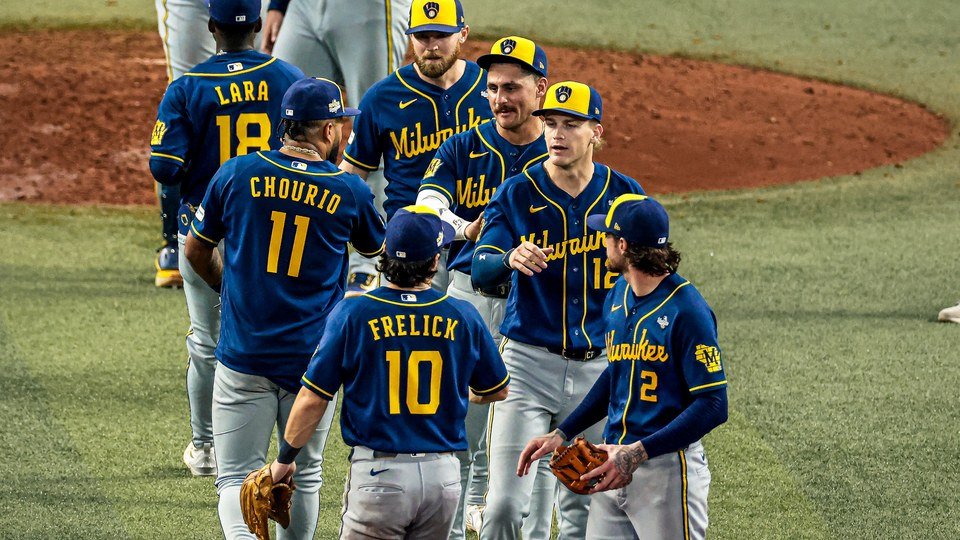 Photo posted on X by @Brewers: Brewers players including Chourio, number 11, and Frelick, number 10, form a handshake line on the field at Tropicana Field after the Game 3 win, Oct. 26, 2026