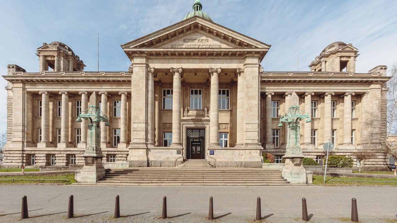 Stand-in, not a photo of this event: the exterior of the Hanseatic Higher Regional Court building in Hamburg-Neustadt, with its brick facade and arched windows under a grey sky (March 2023)