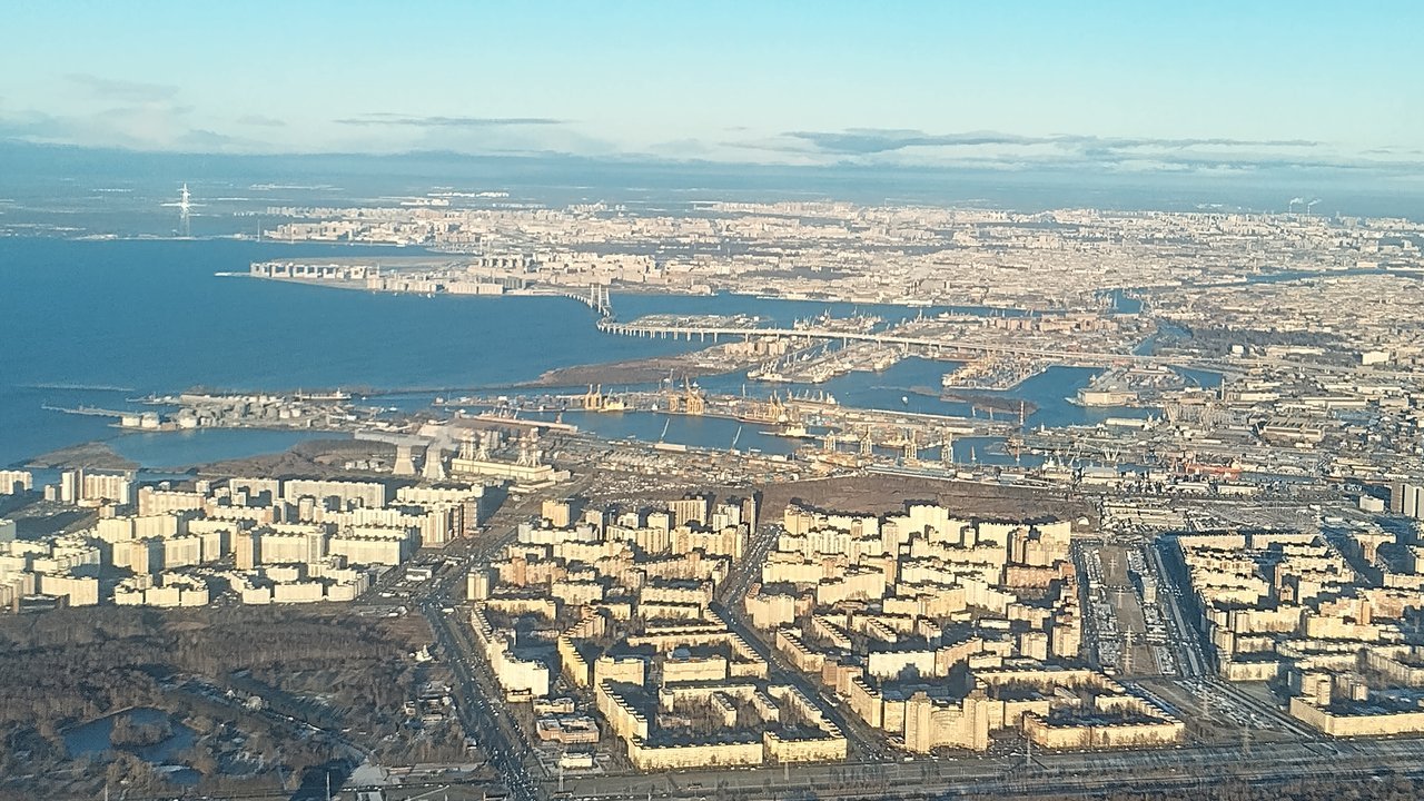 Stand-in, not a photo of this event: November 2024 aerial file photo of Saint Petersburg, with the port's quays and cranes along the Gulf of Finland behind rows of apartment blocks