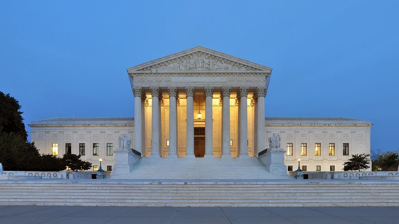 Stand-in: 2011 file photo of the U.S. Supreme Court building at dusk, not a photo of Monday’s argument