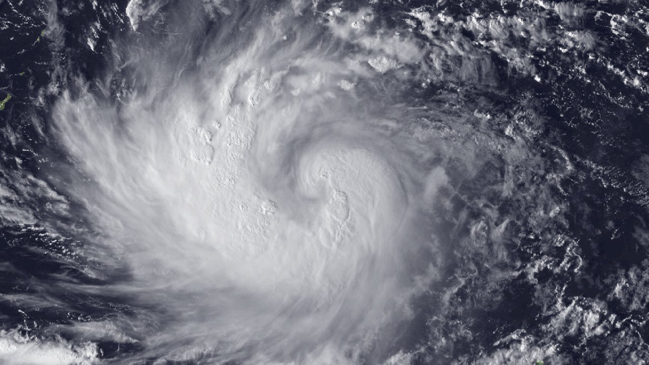 Satellite view of Champi on October 16, 2026, 4:00 PM ChST, a broad swirl of white cloud bands over the western Pacific